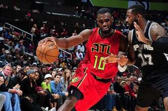 ATLANTA, GA - JANUARY 1:  Tim Hardaway Jr. #10 of the Atlanta Hawks drives to the basket against the San Antonio Spurs on January 1, 2017 at Philips Arena in Atlanta, Georgia.  NOTE TO USER: User expressly acknowledges and agrees that, by downloading and/