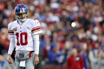 LANDOVER, MD - JANUARY 01: Quarterback Eli Manning #10 of the New York Giants looks on against the Washington Redskins in the first quarter at FedExField on January 1, 2017 in Landover, Maryland. (Photo by Patrick Smith/Getty Images)