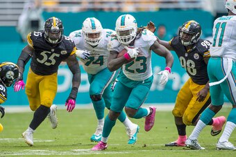 MIAMI GARDENS, FL - OCTOBER 16:  Running back Jay Ajayi #23 of the Miami Dolphins carries the ball during a NFL game against the Pittsburgh Steelers on October 16, 2016 at Hard Rock Stadium in Miami Gardens, Florida.  (Photo by Ronald C. Modra/Sports Imag