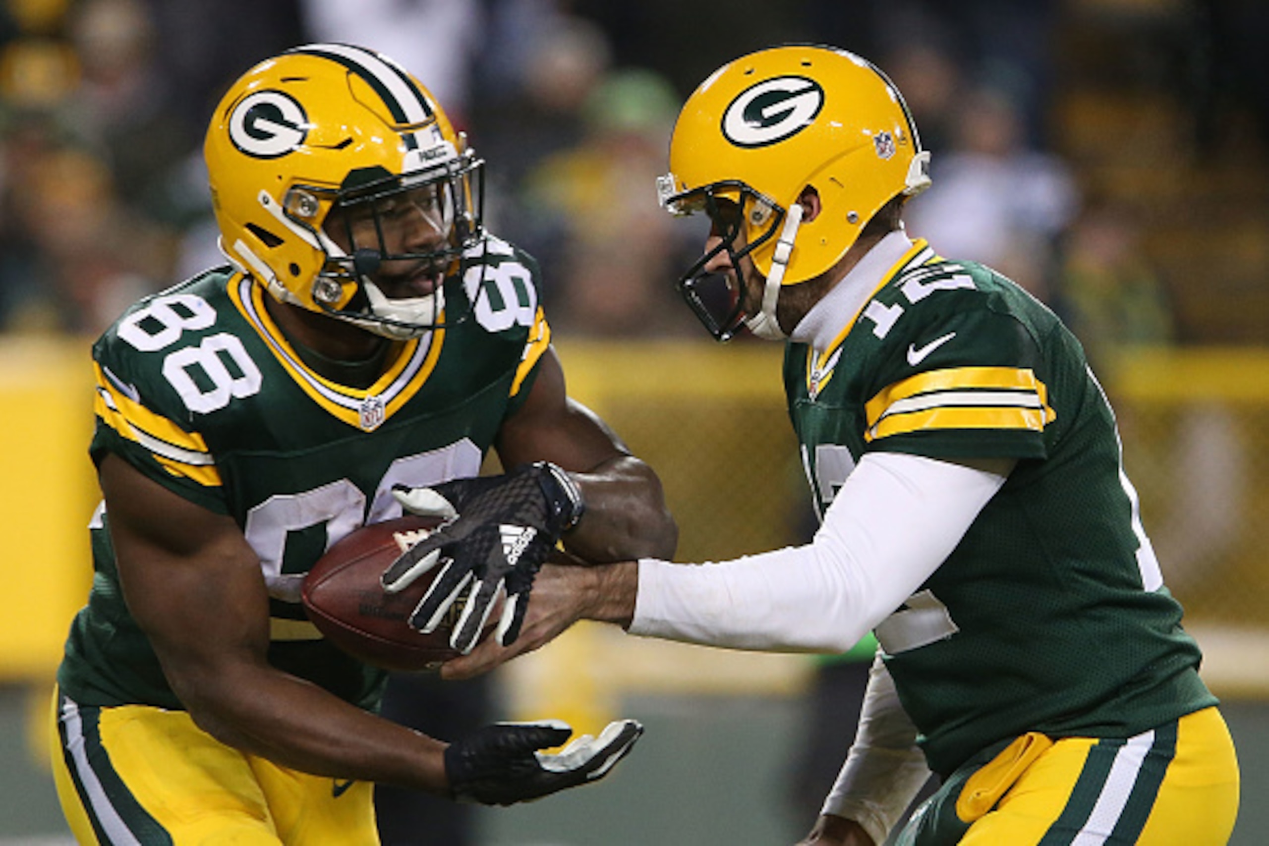 GREEN BAY, WI - DECEMBER 11: Aaron Rodgers #12 of the Green Bay Packers hands the ball off to Ty Montgomery #88 during the first half of a game against the Seattle Seahawks at Lambeau Field on December 11, 2016 in Green Bay, Wisconsin.  (Photo by Dylan Bu