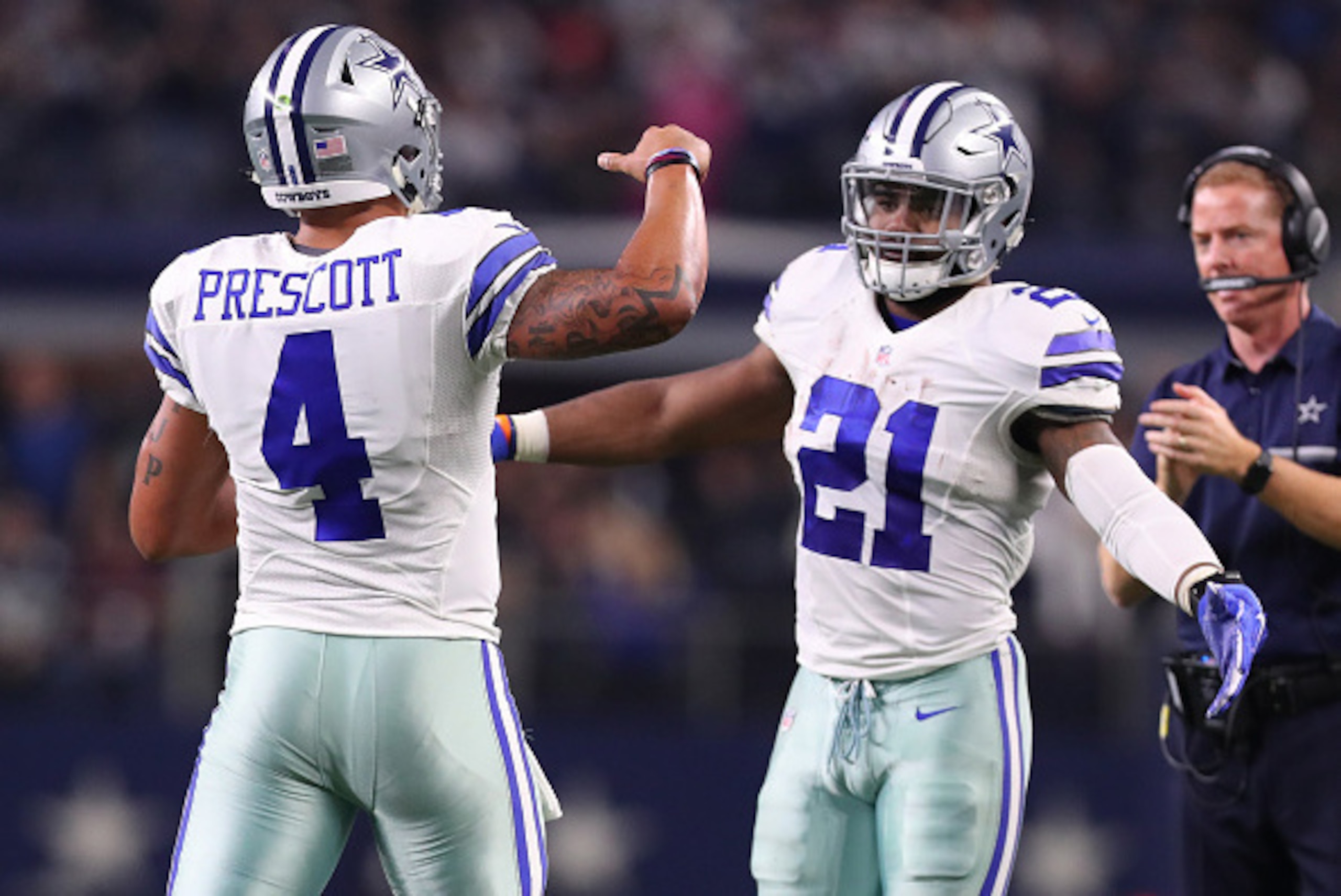 ARLINGTON, TX - DECEMBER 18:  Dak Prescott #4 and Ezekiel Elliott of the Dallas Cowboys celebrate after scoring a touchdown during the second quarter against the Tampa Bay Buccaneers at AT&T Stadium on December 18, 2016 in Arlington, Texas. (Photo by Tom 