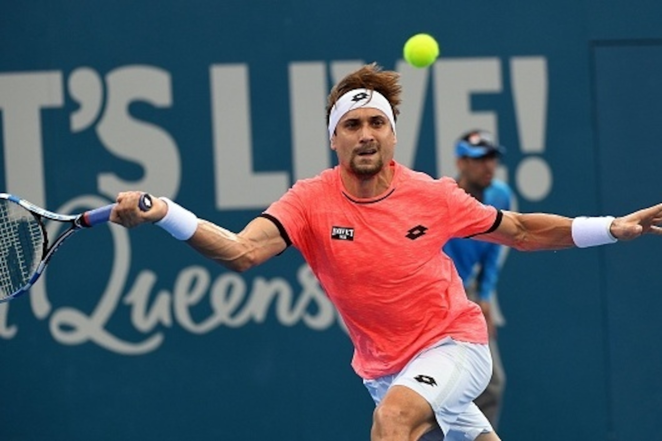 David Ferrer of Spain hits a return against Australia's Bernard Tomic in the men's first round at the Brisbane International tennis tournament in Brisbane on January 2, 2017. / AFP / SAEED KHAN / --IMAGE RESTRICTED TO EDITORIAL USE - STRICTLY NO COMMERCIA
