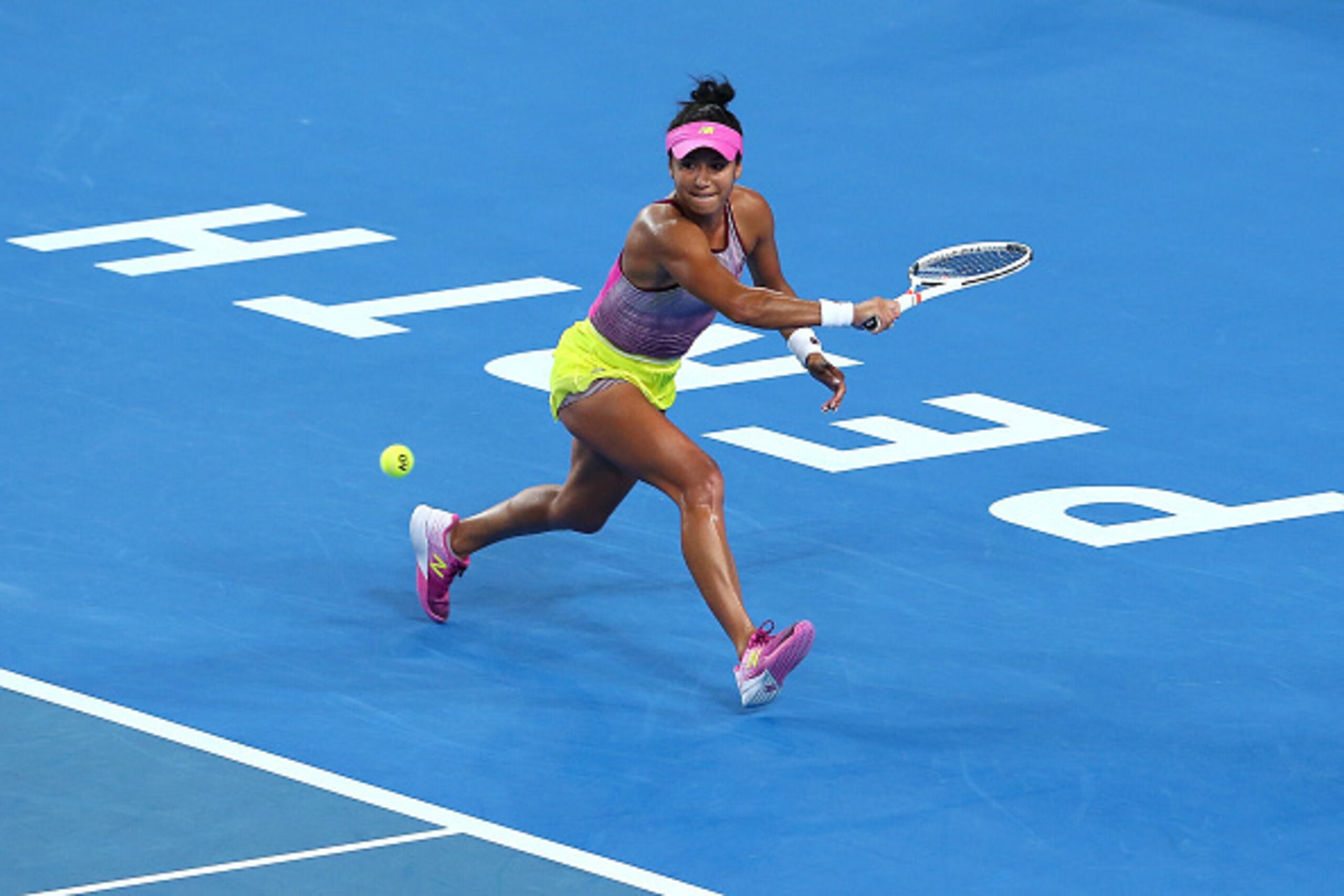PERTH, AUSTRALIA - JANUARY 02:  Heather Watson of Great Britain plays a backhand in the women's singles match  against Belinda Bencic of Switzerland on day two of the 2017 Hopman Cup at Perth Arena on January 2, 2017 in Perth, Australia.  (Photo by Paul K
