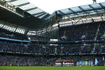 MANCHESTER, ENGLAND - JANUARY 02: The Burnley and Manchester City teams take part in a minutes silence in memory of the fans that have passed away in 2016 during the Premier League match between Manchester City and Burnley at Etihad Stadium on January 2, 