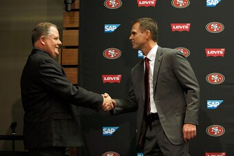 SANTA CLARA, CA - JANUARY 20:  Chip Kelly and San Francisco 49ers general manager Trent Baalke shake hands at a press conference where Kelly was announced as the new head coach of the San Francisco 49ers at Levi's Stadium on January 20, 2016 in Santa Clar