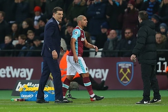 STRATFORD, ENGLAND - JANUARY 02: Slaven Bilic Manager / head coach of West Ham United looks over to the fourth official as Sofiane Feghouli of West Ham walks past having been sent off during the Premier League match between West Ham United and Manchester 