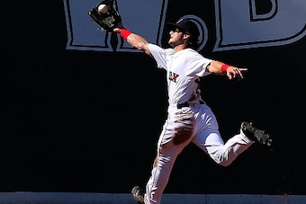 BOSTON, MA - AUGUST 14:  Andrew Benintendi #40 of the Boston Red Sox makes a running catch against the Arizona Diamondbacks in the seventh inning at Fenway Park on August 14, 2016 in Boston, Massachusetts. (Photo by Jim Rogash/Getty Images)