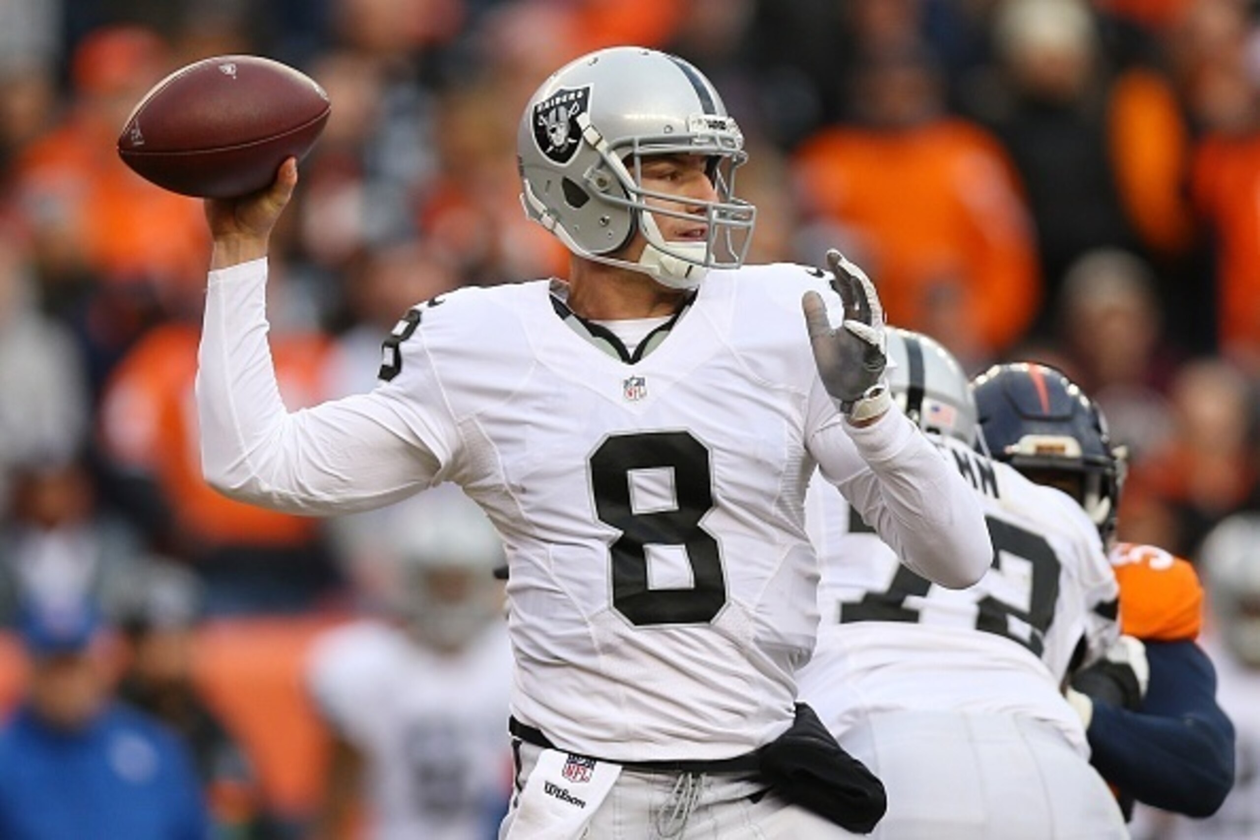 DENVER, CO - JANUARY 1:  Quarterback Connor Cook #8 of the Oakland Raiders throws in the second quarter of the game against the Denver Broncos at Sports Authority Field at Mile High on January 1, 2017 in Denver, Colorado. (Photo by Justin Edmonds/Getty Im