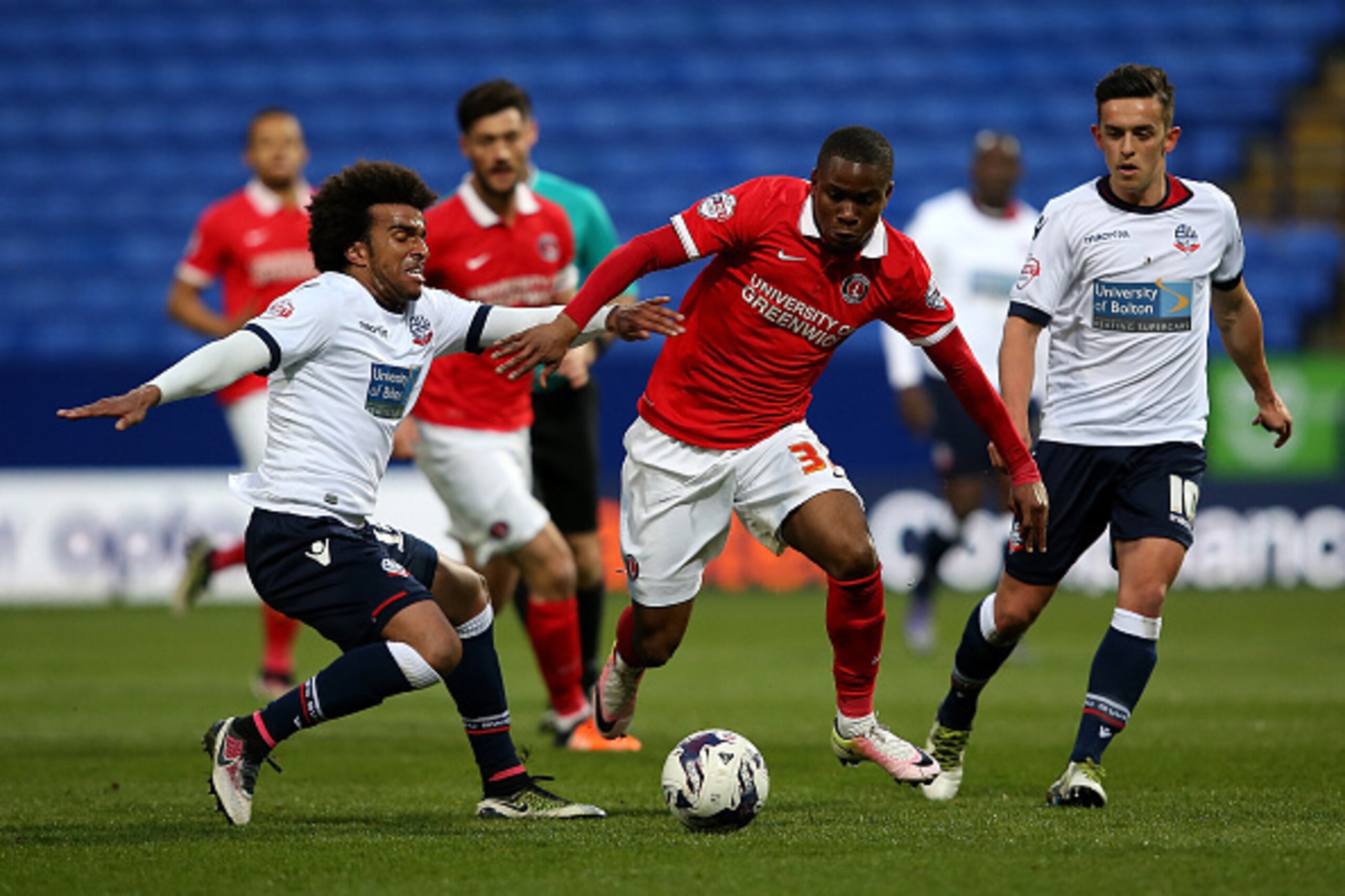 BOLTON, ENGLAND - APRIL 19:  Mark Davies of Bolton Wanderers battles with Ademola Lookman of Charlton Athletic during the Sky Bet Championship match between Bolton Wanderers and Charlton Athletic at Reebok Stadium on April 19, 2016 in Bolton, United Kingd