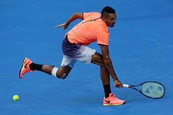 PERTH, AUSTRALIA - JANUARY 03:  Nick Kyrgios of Australia plays a backhand to Adam Pavlasek of the Czech Republic in the Mens singles match on day three of the 2017 Hopman Cup at Perth Arena on January 3, 2017 in Perth, Australia.  (Photo by Will Russell/