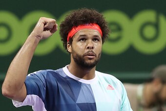 France's Jo-Wilfried Tsonga celebrates after winning against Andrey Kuznetsov of Russia on the fourth day of the ATP Qatar Open tennis competition in Doha on January 3, 2017.  / AFP / KARIM JAAFAR        (Photo credit should read KARIM JAAFAR/AFP/Getty Im