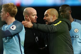 MANCHESTER, ENGLAND - JANUARY 02: Referee Lee Mason aruges with Josep Guardiola, Manager of Manchester City after the Premier League match between Manchester City and Burnley at Etihad Stadium on January 2, 2017 in Manchester, England.  (Photo by Jan Krug