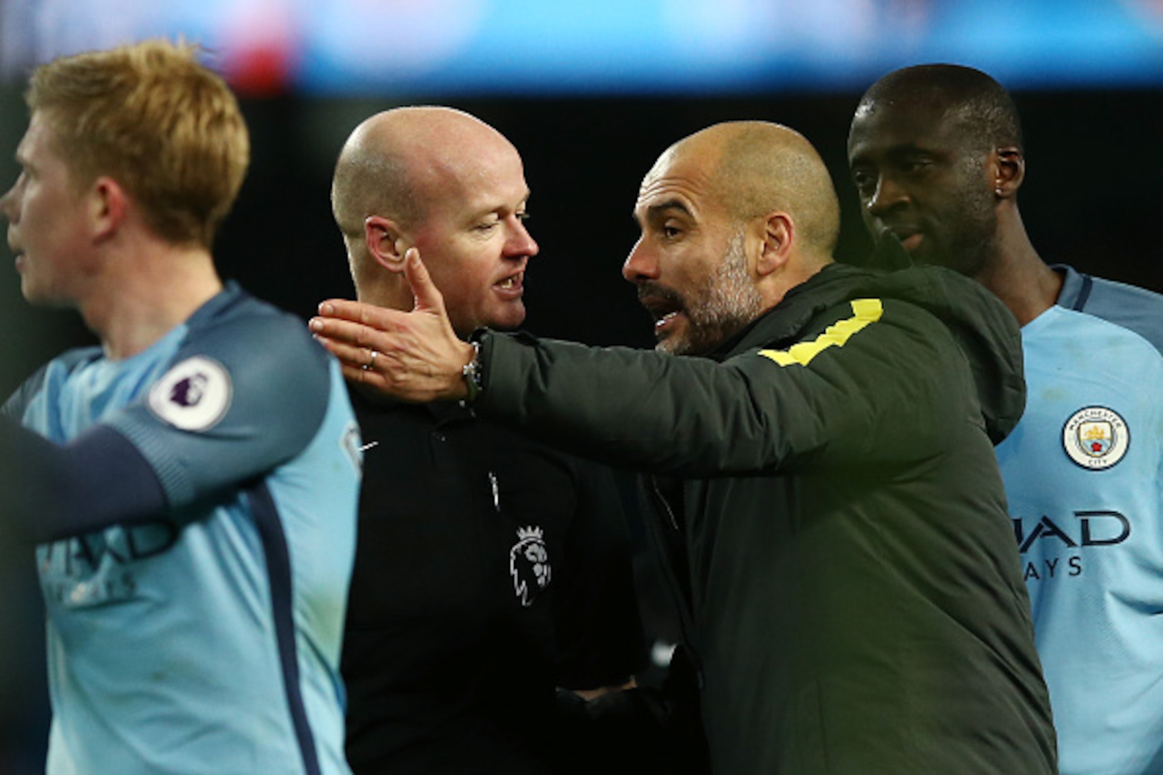 MANCHESTER, ENGLAND - JANUARY 02: Referee Lee Mason aruges with Josep Guardiola, Manager of Manchester City after the Premier League match between Manchester City and Burnley at Etihad Stadium on January 2, 2017 in Manchester, England.  (Photo by Jan Krug