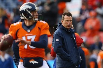 DENVER, CO - JANUARY 1:  Head coach Gary Kubiak of the Denver Broncos watches Trevor Siemian warm up before the game against the Oakland Raiders at Sports Authority Field at Mile High on January 1, 2017 in Denver, Colorado. (Photo by Justin Edmonds/Getty 