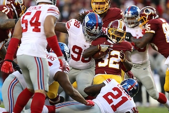 LANDOVER, MD - JANUARY 01: Running back Rob Kelley #32 of the Washington Redskins carries the ball against defensive tackle Damon Harrison #98 of the New York Giants in the first quarter at FedExField on January 1, 2017 in Landover, Maryland. (Photo by Ro