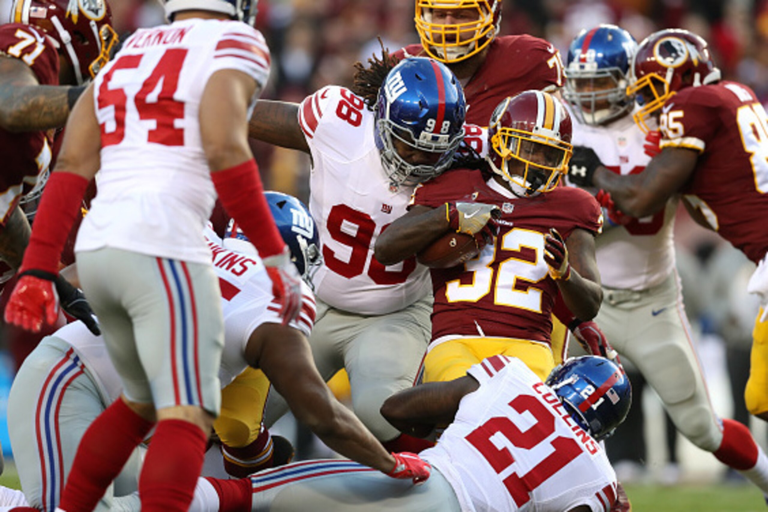 LANDOVER, MD - JANUARY 01: Running back Rob Kelley #32 of the Washington Redskins carries the ball against defensive tackle Damon Harrison #98 of the New York Giants in the first quarter at FedExField on January 1, 2017 in Landover, Maryland. (Photo by Ro