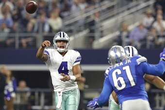 ARLINGTON, TX - DECEMBER 26: Dak Prescott #4 of the Dallas Cowboys throws as Kerry Hyder #61 of the Detroit Lions defends during the first half at AT&T Stadium on December 26, 2016 in Arlington, Texas. (Photo by Ronald Martinez/Getty Images)