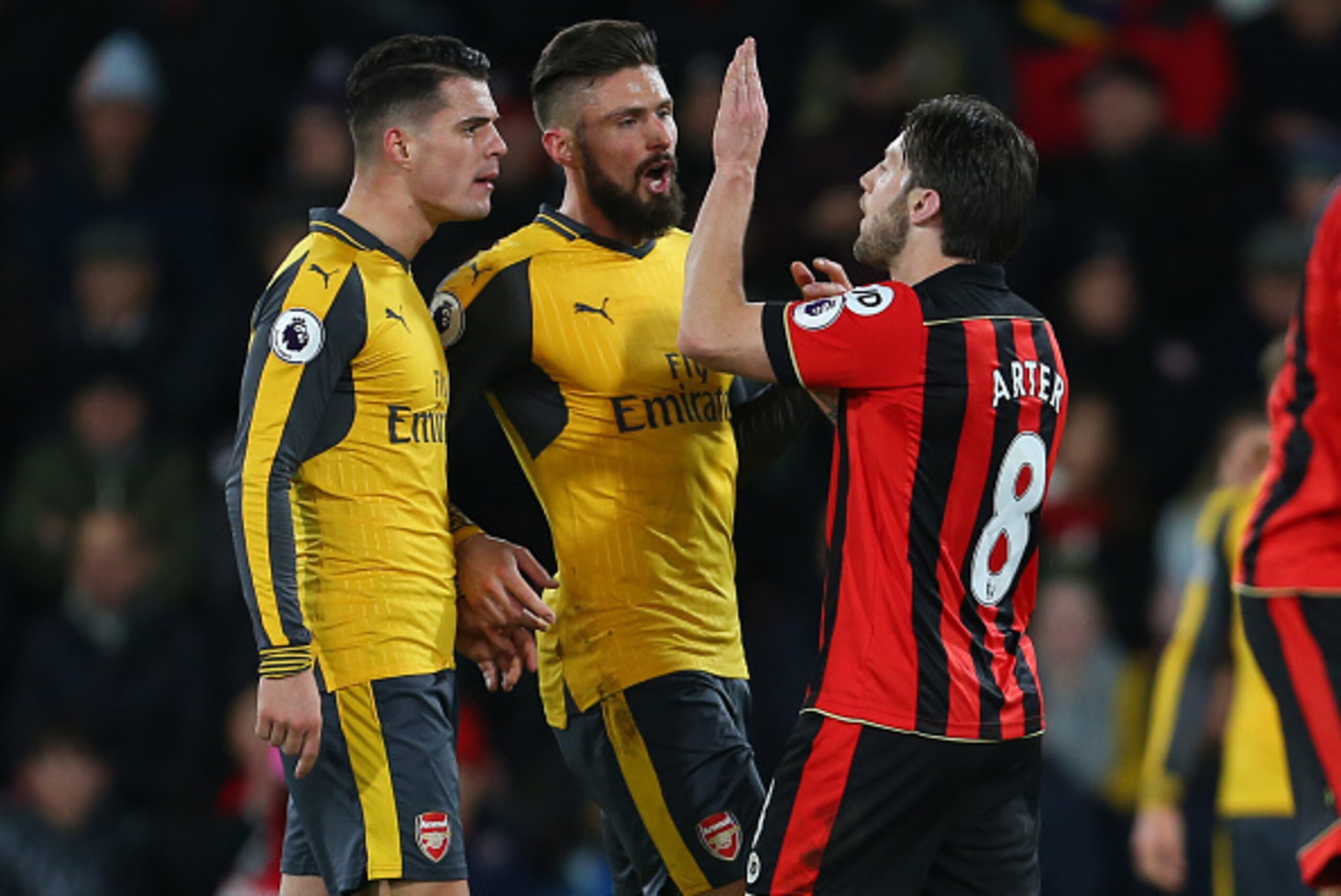 BOURNEMOUTH, ENGLAND - JANUARY 03: Tensions flare between Harry Arter of Bournemouth, Granit Xhaka and Olivier Giroud of Arsenal during the Premier League match between AFC Bournemouth and Arsenal at Vitality Stadium on January 3, 2017 in Bournemouth, Eng BOURNEMOUTH, ENGLAND - JANUARY 03: Tensions flare between Harry Arter of Bournemouth, Granit Xhaka and Olivier Giroud of Arsenal during the Premier League match between AFC Bournemouth and Arsenal at Vitality Stadium on January 3, 2017 in Bournemouth, Eng