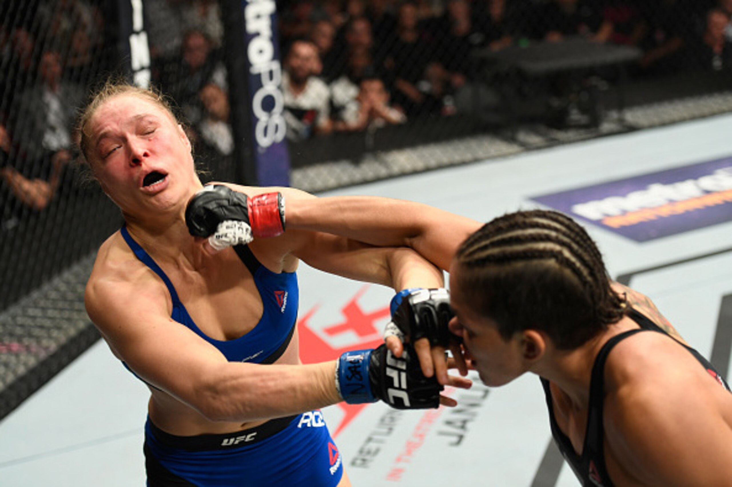 LAS VEGAS, NV - DECEMBER 30: (R-L) Amanda Nunes of Brazil punches Ronda Rousey in their UFC women's bantamweight championship bout during the UFC 207 event at T-Mobile Arena on December 30, 2016 in Las Vegas, Nevada.  (Photo by Josh Hedges/Zuffa LLC/Zuffa