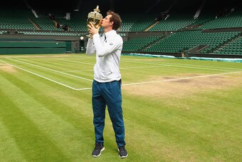 LONDON, ENGLAND - JULY 11:  Andy Murray of Great Britain revisits centre court as he kisses the trophy at Wimbledon on July 11, 2016 in London, England.  (Photo by Julian Finney/Getty Images)