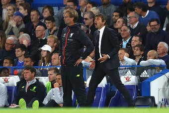 LONDON, ENGLAND - SEPTEMBER 16: Antonio Conte, Manager of Chelsea and Jurgen Klopp, Manager of Liverpool look on from the touchline during the Premier League match between Chelsea and Liverpool at Stamford Bridge on September 16, 2016 in London, England. 