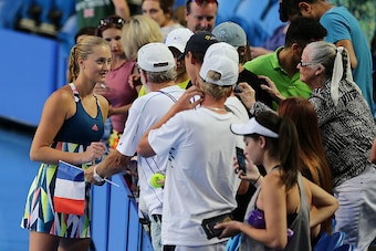 PERTH, AUSTRALIA - JANUARY 04: Kristina Mladenovic of France signs autographs after defeating Heather Watson and Dan Evans of Great Britain in in the mixed doubles match on day four of the 2017 Hopman Cup at Perth Arena on January 4, 2017 in Perth, Austra