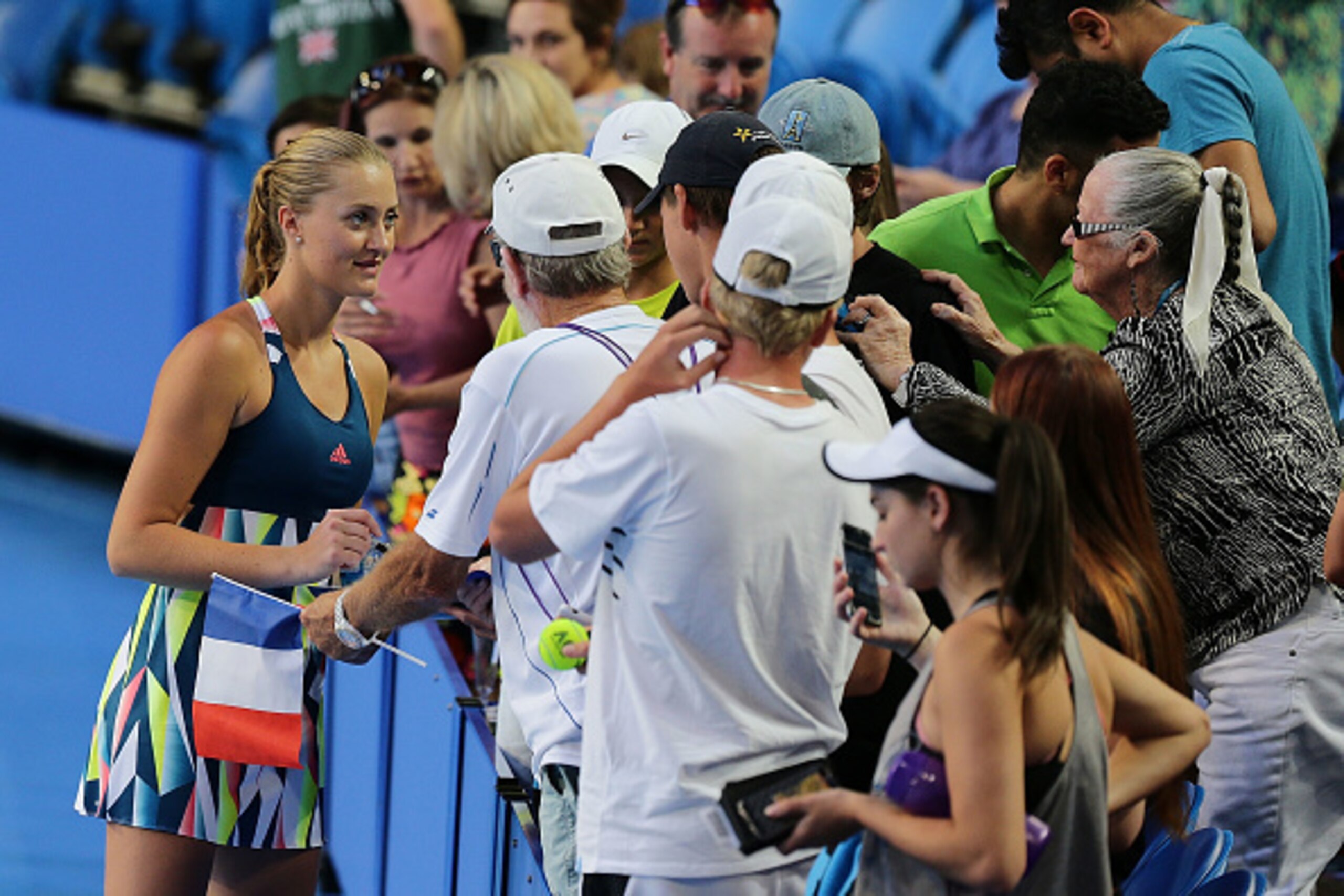 PERTH, AUSTRALIA - JANUARY 04: Kristina Mladenovic of France signs autographs after defeating Heather Watson and Dan Evans of Great Britain in in the mixed doubles match on day four of the 2017 Hopman Cup at Perth Arena on January 4, 2017 in Perth, Austra