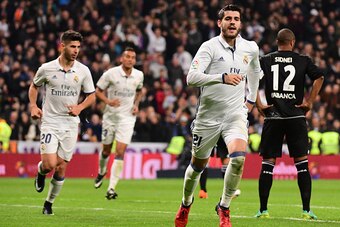 Real Madrid's forward Alvaro Morata celebrates after scoring during the Spanish league football match Real Madrid CF vs RC Deportivo at the Santiago Bernabeu stadium in Madrid on December 10, 2016. / AFP / PIERRE-PHILIPPE MARCOU        (Photo credit shoul