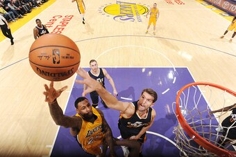 LOS ANGELES, CA - DECEMBER 5:  Tarik Black #28 of the Los Angeles Lakers shoots the ball against Jeff Withey #24 of the Utah Jazz during the game on December 5, 2016 at STAPLES Center in Los Angeles, California. NOTE TO USER: User expressly acknowledges a