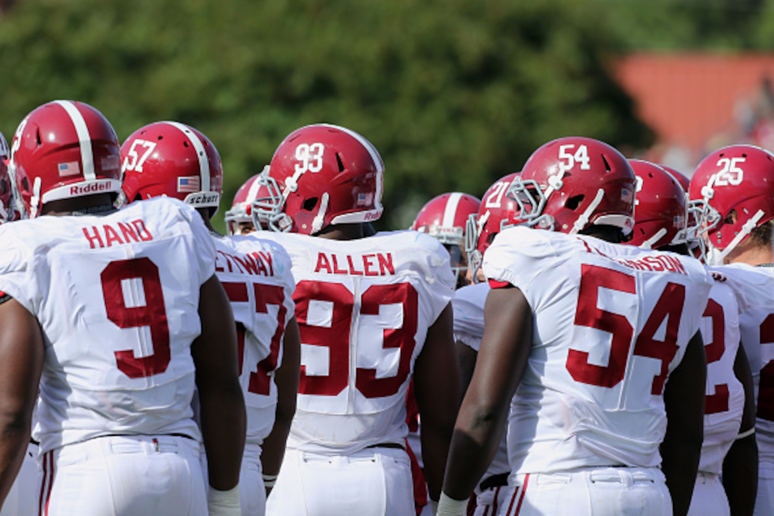 OXFORD, MS - OCTOBER 4: Da'Shawn Hand #9, Xzavier Dickson #47, Jonathan Allen #93 and Dalvin Tomlinson #54 of the Alabama Crimson Tide huddle with the defense against the Ole Miss Rebels on October 4, 2014 at Vaught-Hemingway Stadium in Oxford, Mississipp