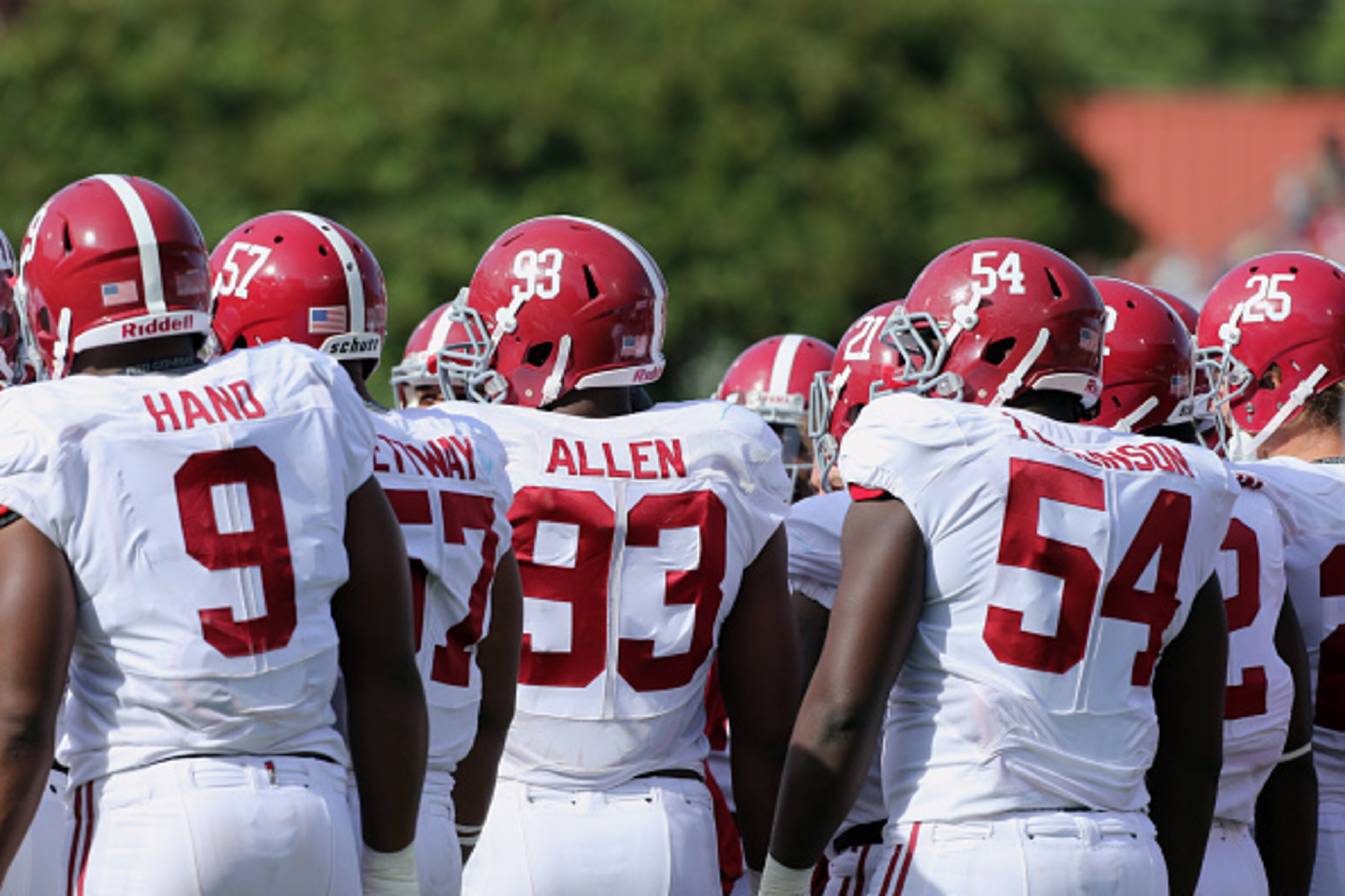 OXFORD, MS - OCTOBER 4: Da'Shawn Hand #9, Xzavier Dickson #47, Jonathan Allen #93 and Dalvin Tomlinson #54 of the Alabama Crimson Tide huddle with the defense against the Ole Miss Rebels on October 4, 2014 at Vaught-Hemingway Stadium in Oxford, Mississipp