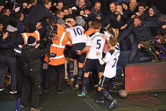 LONDON, ENGLAND - JANUARY 04:  Dele Alli of Tottenham Hotspur celebrates scoring his sides first goal with his Tottenham Hotspur team mates and fans during the Premier League match between Tottenham Hotspur and Chelsea at White Hart Lane on January 4, 201