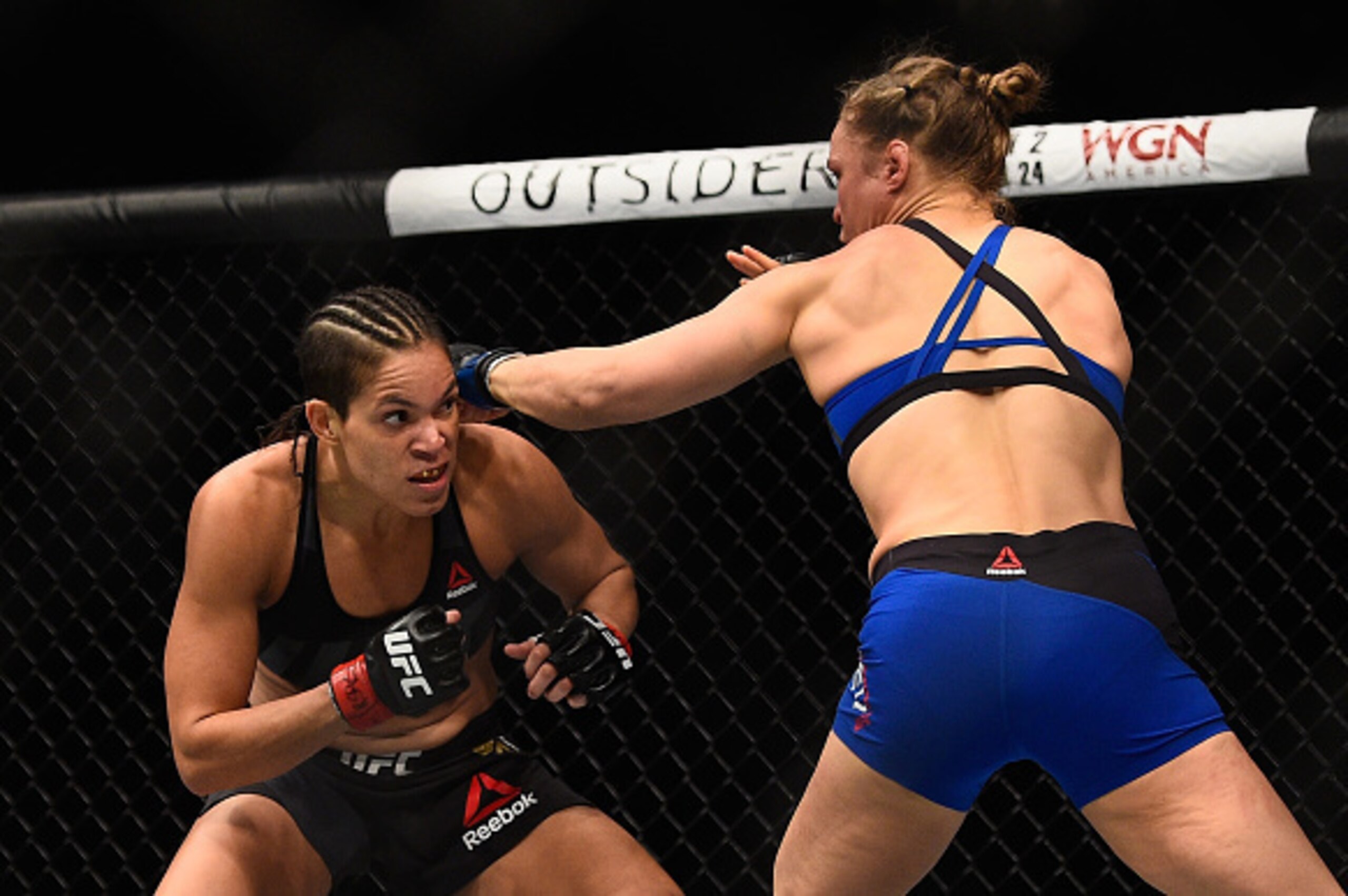 LAS VEGAS, NV - DECEMBER 30: (R-L) Ronda Rousey punches Amanda Nunes of Brazil in their UFC women's bantamweight championship bout during the UFC 207 event at T-Mobile Arena on December 30, 2016 in Las Vegas, Nevada.  (Photo by Jeff Bottari/Zuffa LLC/Zuff