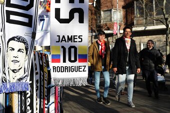 MADRID, SPAIN - JANUARY 04:  Real Madrid scarves featuring James Rodriguez and Cristiano Ronaldo are displayed at a stall outside the Bernabeu ahead of the Copa del Rey Round of 16 First Leg match between Real Madrid and Sevilla on January 4, 2017 in Madr