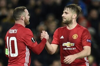 Manchester United's English striker Wayne Rooney (L) celebrates scoring the opening goal with Manchester United's English defender Luke Shaw (R) during the UEFA Europa League group A football match between Manchester United and Feyenoord at Old Trafford s