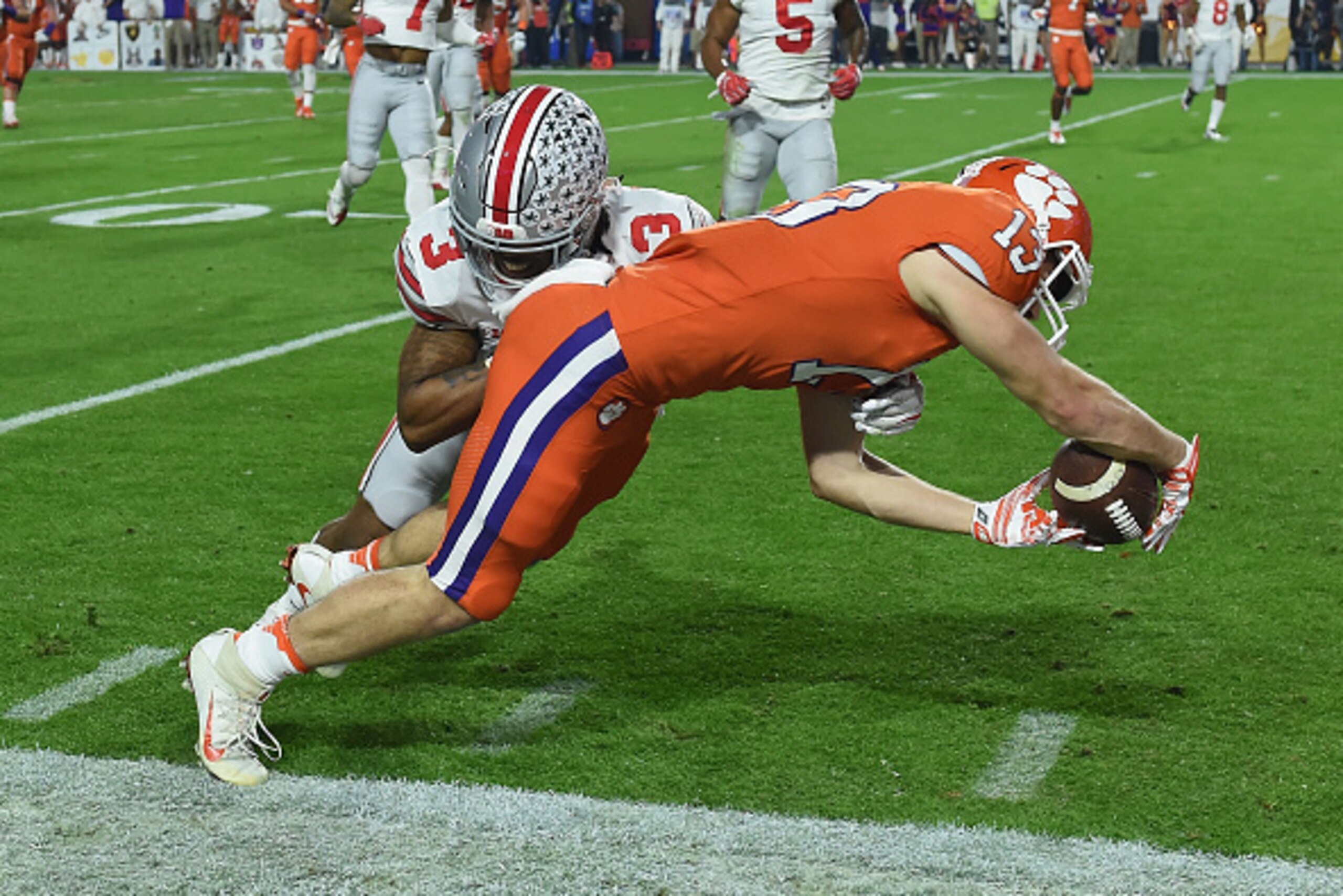 GLENDALE, AZ - DECEMBER 31:  Hunter Renfrow #13 of the Clemson Tigers is hit by Damon Arnette #3 of the Ohio State Buckeyes during the first half of the 2016 PlayStation Fiesta Bowl at University of Phoenix Stadium on December 31, 2016 in Glendale, Arizon
