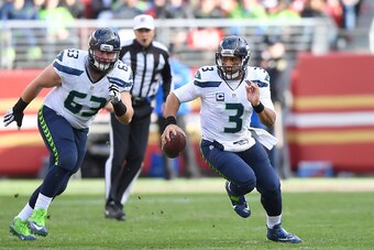 SANTA CLARA, CA - JANUARY 01:  Russell Wilson #3 of the Seattle Seahawks runs with the ball against the San Francisco 49ers during the second quarter of their NFL football game at Levi's Stadium on January 1, 2017 in Santa Clara, California.  (Photo by Th