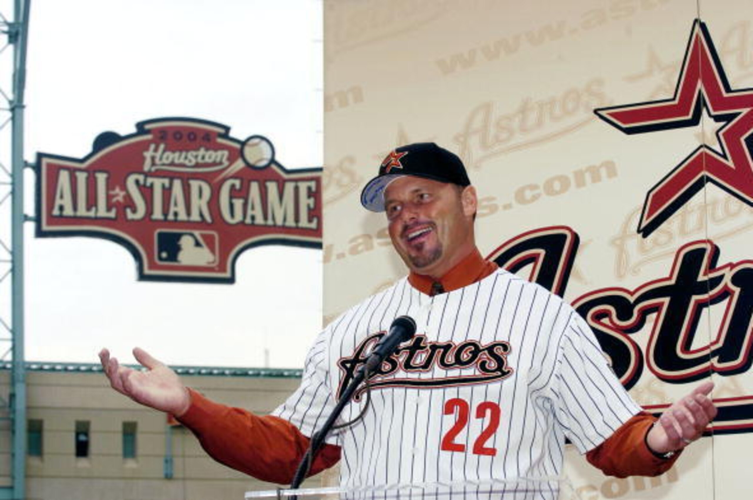 HOUSTON - JANUARY 12:  Former New York Yankees pitcher Roger Clemens gestures as he answers questions from the media during a press conference to announce the signing of Clemens to a 1-year $5 million contract with the Houston Astros on January 12, 2004 a
