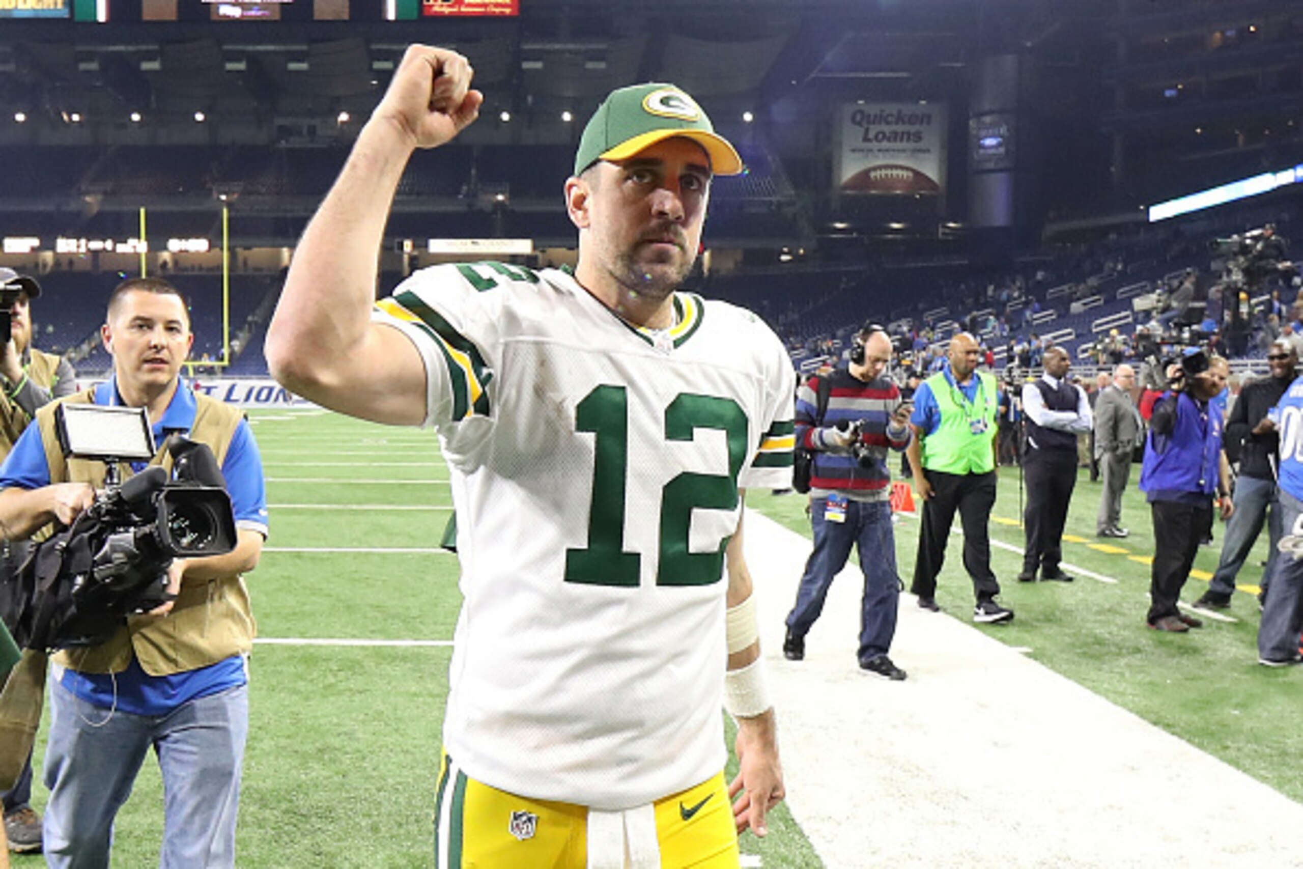 DETROIT, MI - JANUARY 01: Aaron Rodgers #12 of the Green Bay Packers celebrates a win over the Detroit Lions at Ford Field on January 1, 2017 in Detroit, Michigan. Green Bay defeated Detroit 31-24. (Photo by Leon Halip/Getty Images)
