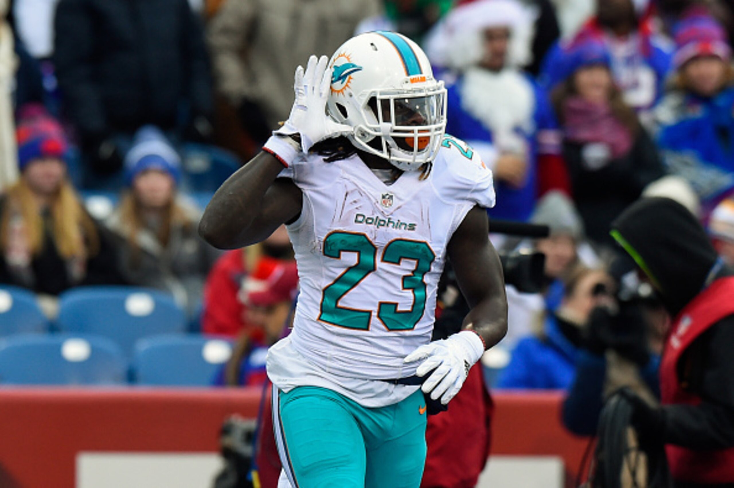 ORCHARD PARK, NY - DECEMBER 24:  Jay Ajayi #23 of the Miami Dolphins gestures following his touchdown run against the Buffalo Bills during the first quarter at New Era Field on December 24, 2016 in Orchard Park, New York. The Miami Dolphins defeated the B