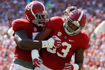 TUSCALOOSA, AL - SEPTEMBER 10:  Jonathan Allen #93 is congratulated by Dalvin Tomlinson #54 of the Alabama Crimson Tide after a sack against the Western Kentucky Hilltoppers at Bryant-Denny Stadium on September 10, 2016 in Tuscaloosa, Alabama.  (Photo by 
