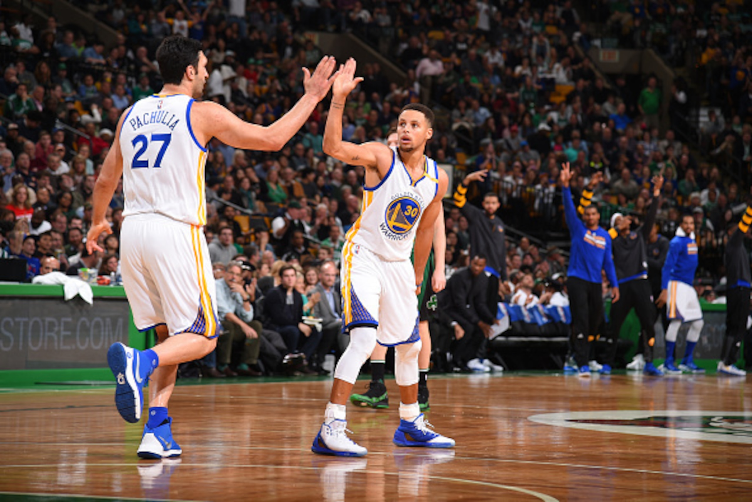 BOSTON, MA - NOVEMBER 18:  Stephen Curry #30 and Zaza Pachulia #27 of the Golden State Warriors celebrate during a game against the Boston Celtics on November 18, 2016 at TD Garden in Boston, Massachusetts. NOTE TO USER: User expressly acknowledges and ag