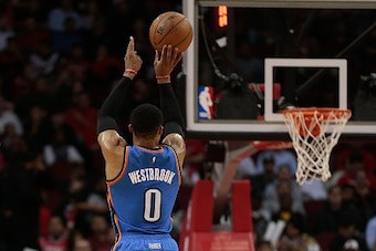 HOUSTON, TX - JANUARY 05:  Russell Westbrook #0 of the Oklahoma City Thunder shoots a three-point shot as Sam Dekker #7 of the Houston Rockets looks on at Toyota Center on January 5, 2017 in Houston, Texas. NOTE TO USER: User expressly acknowledges and ag