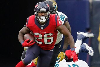 HOUSTON, TX - DECEMBER 18:  Lamar Miller #26 of the Houston Texans carries the ball in the third quarter against the Jacksonville Jaguars at NRG Stadium on December 18, 2016 in Houston, Texas.  (Photo by Tim Warner/Getty Images)