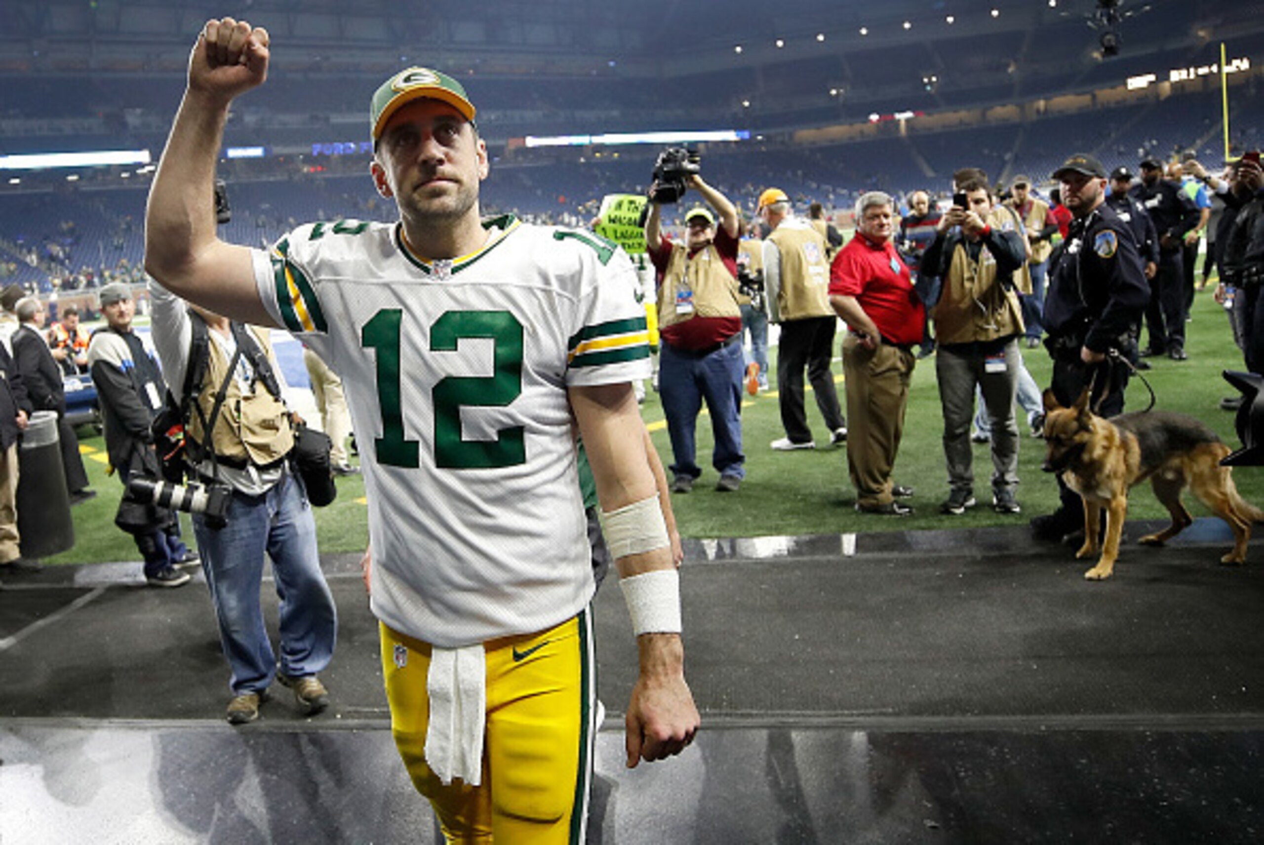DETROIT, MI - JANUARY 1: Quarterback Aaron Rodgers #12 of the Green Bay Packers raises his fist as he leaves the field after defeating the Detroit Lions 31-24 at Ford Field on January 1, 2017 in Detroit, Michigan (Photo by Gregory Shamus/Getty Images)