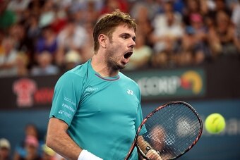 Switzerland's Stan Wawrinka reacts on a point against Kyle Edmund of Germany in their men's single quarter-final match at the Brisbane International tennis tournament in Brisbane on January 6 , 2017. / AFP / SAEED KHAN / IMAGE RESTRICTED TO EDITORIAL USE 