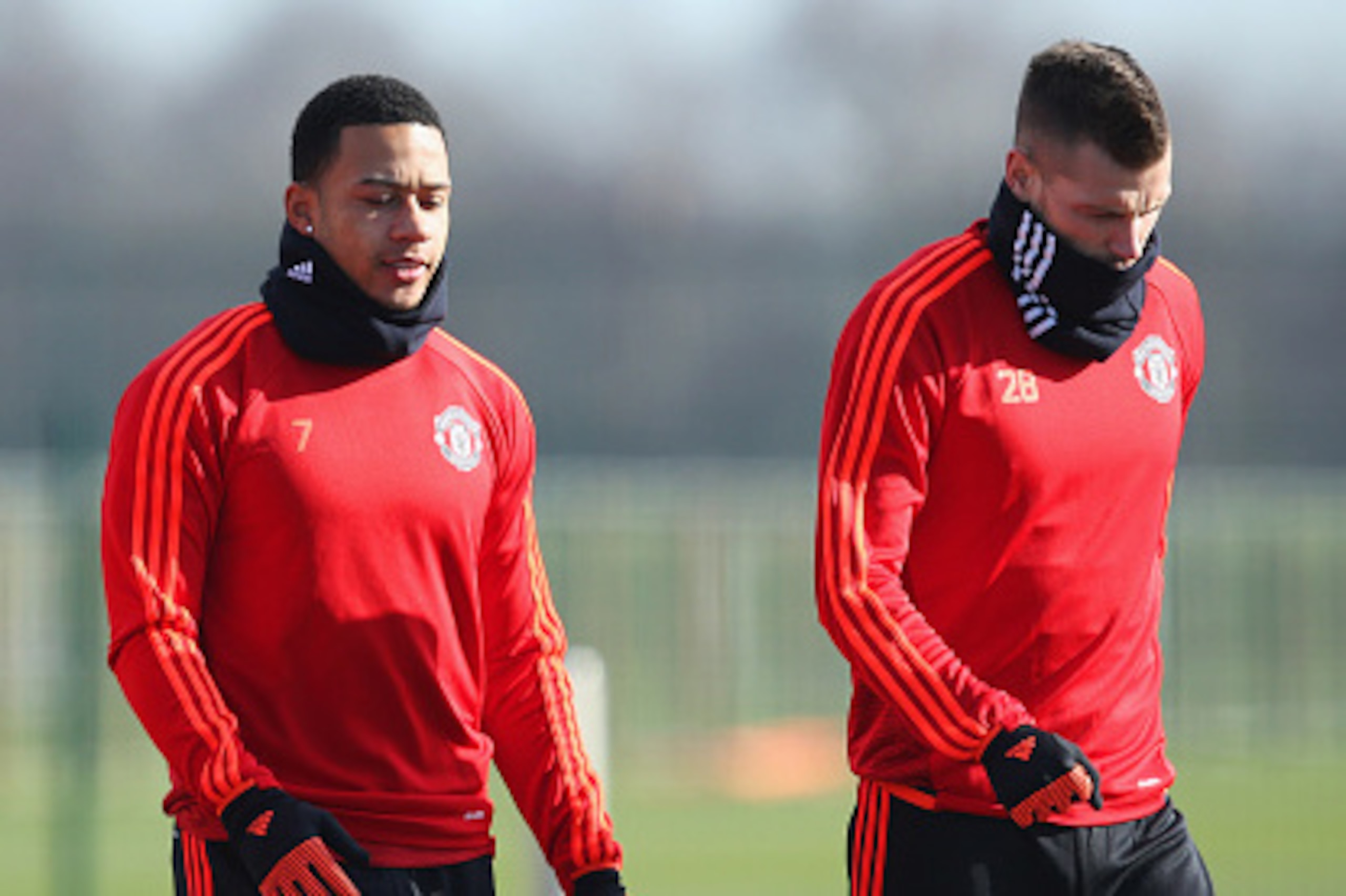MANCHESTER, ENGLAND - FEBRUARY 24:  (L-R) Anthony Martial, Memphis Depay and Morgan Schneiderlin look on during a Manchester United training session ahead of their UEFA Europa League round of 32 second leg match against FC Midtjylland at the Aon Training 