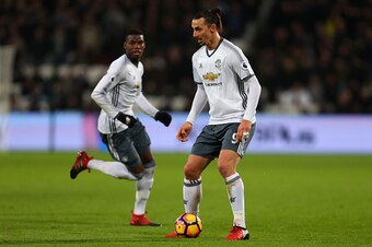 STRATFORD, ENGLAND - JANUARY 02: Zlatan Ibrahimovic of Manchester United is watched by Paul Pogba of Manchester United during the Premier League match between West Ham United and Manchester United at London Stadium on January 2, 2017 in Stratford, England