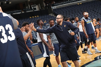 MEMPHIS, TN - OCTOBER 1:  David Fizdale of the Memphis Grizzlies high fives teammates during an open practice on October 1, 2016 at FedExForum in Memphis, Tennessee.  NOTE TO USER: User expressly acknowledges and agrees that, by downloading and or using t