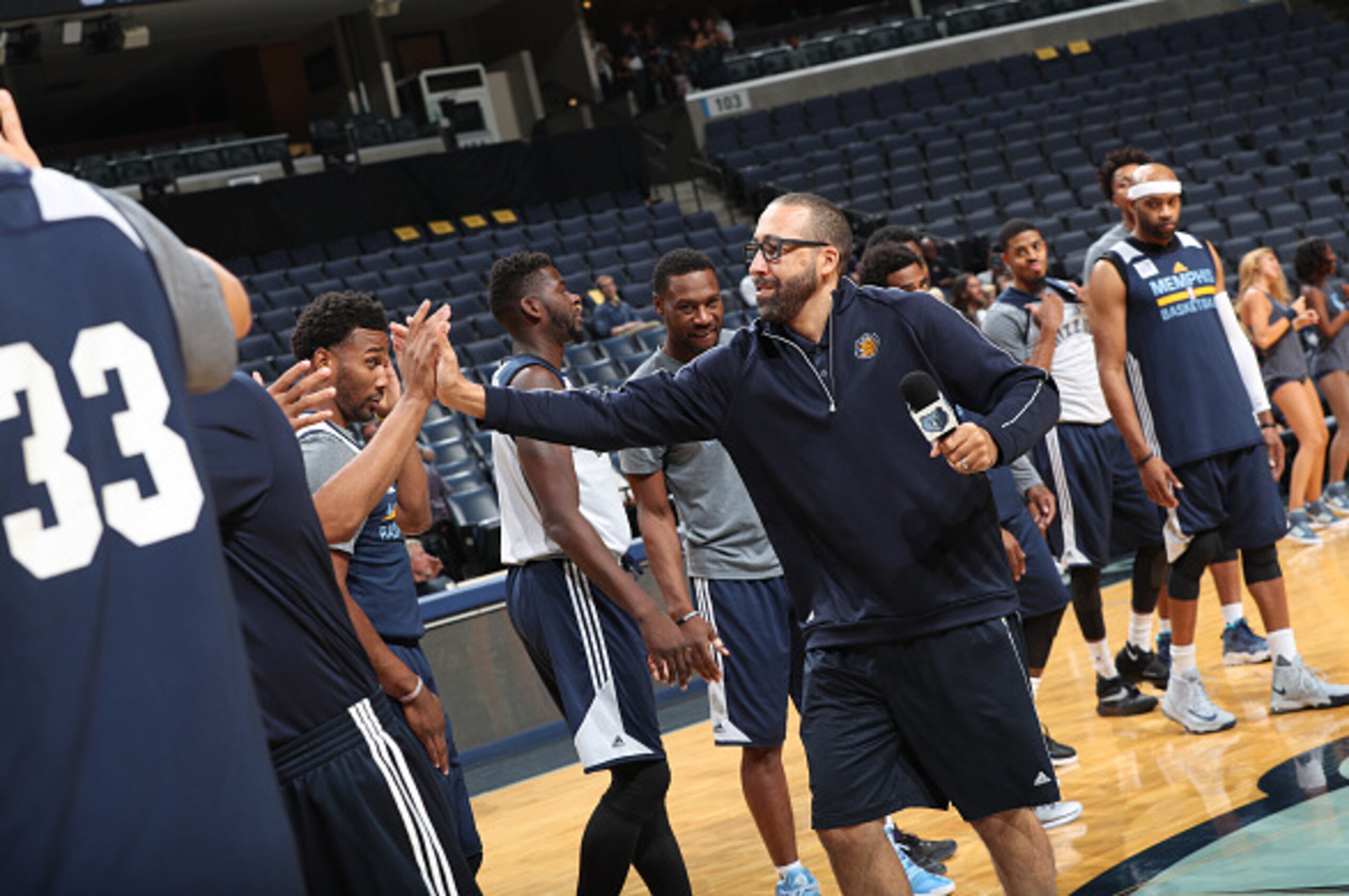 MEMPHIS, TN - OCTOBER 1:  David Fizdale of the Memphis Grizzlies high fives teammates during an open practice on October 1, 2016 at FedExForum in Memphis, Tennessee.  NOTE TO USER: User expressly acknowledges and agrees that, by downloading and or using t